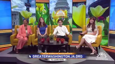 Four people sitting on a couch for an interview